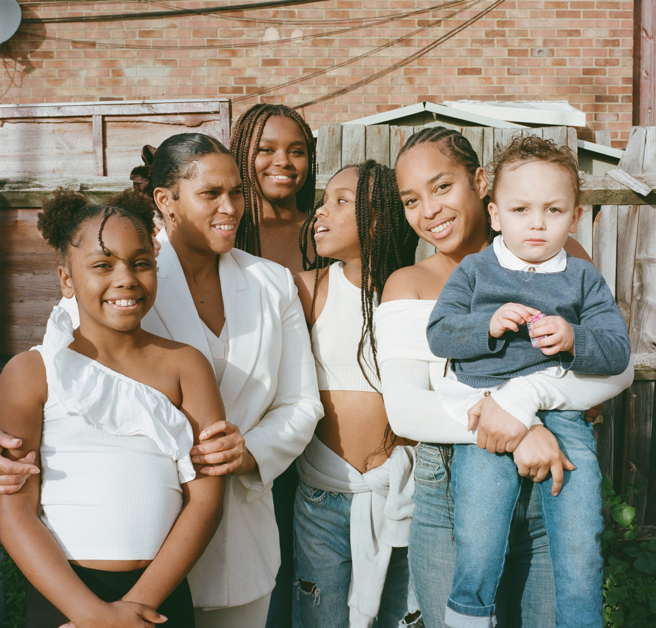 A family together outdoors, showcasing the bond of familial love.