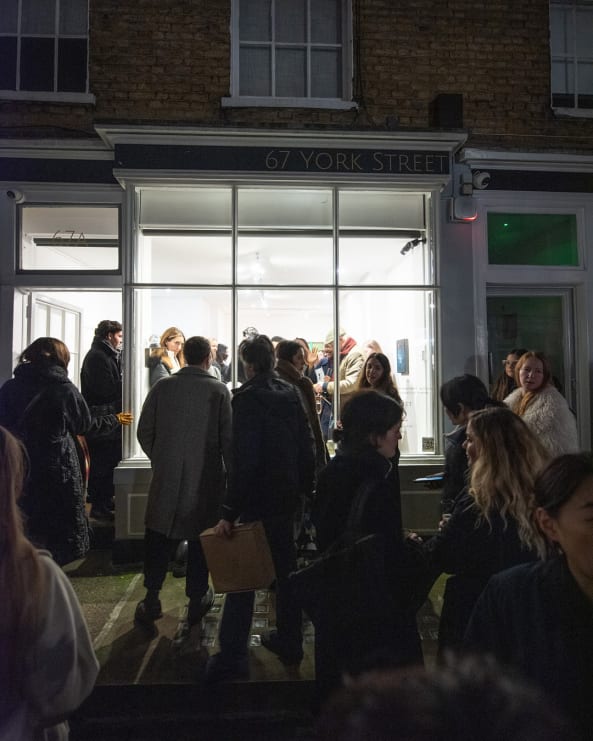 A crowd in front of 67 York street's gallery for an event