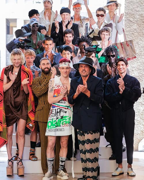 Designer Andreas Kronthaler with models closing the Vivienne Westwood Men’s Spring/Summer show at Milan Fashion Week, celebrating the brand’s runway return.