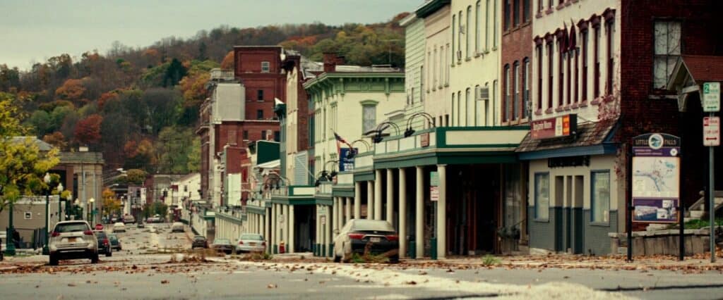Deserted small-town street scene from A Quiet Place (2018) illustrating post-apocalyptic silence and human absence.
