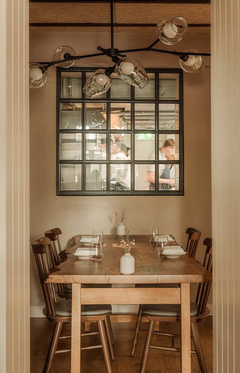 Warm wooden private dining table setup inside The Silver Birch restaurant.