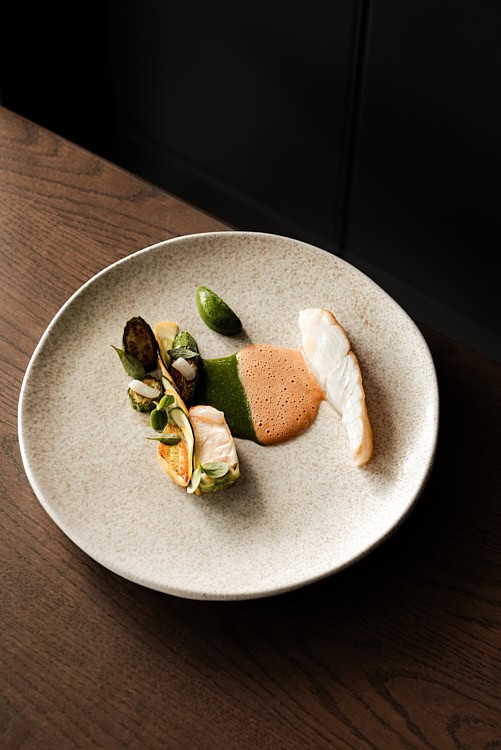 Delicately plated fish dish with vegetables and sauces at The Silver Birch.