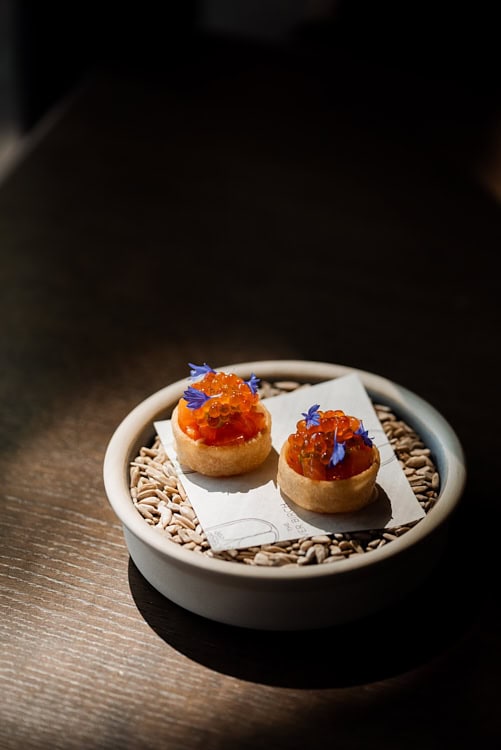 Salmon roe tartlets with edible flowers served at The Silver Birch.