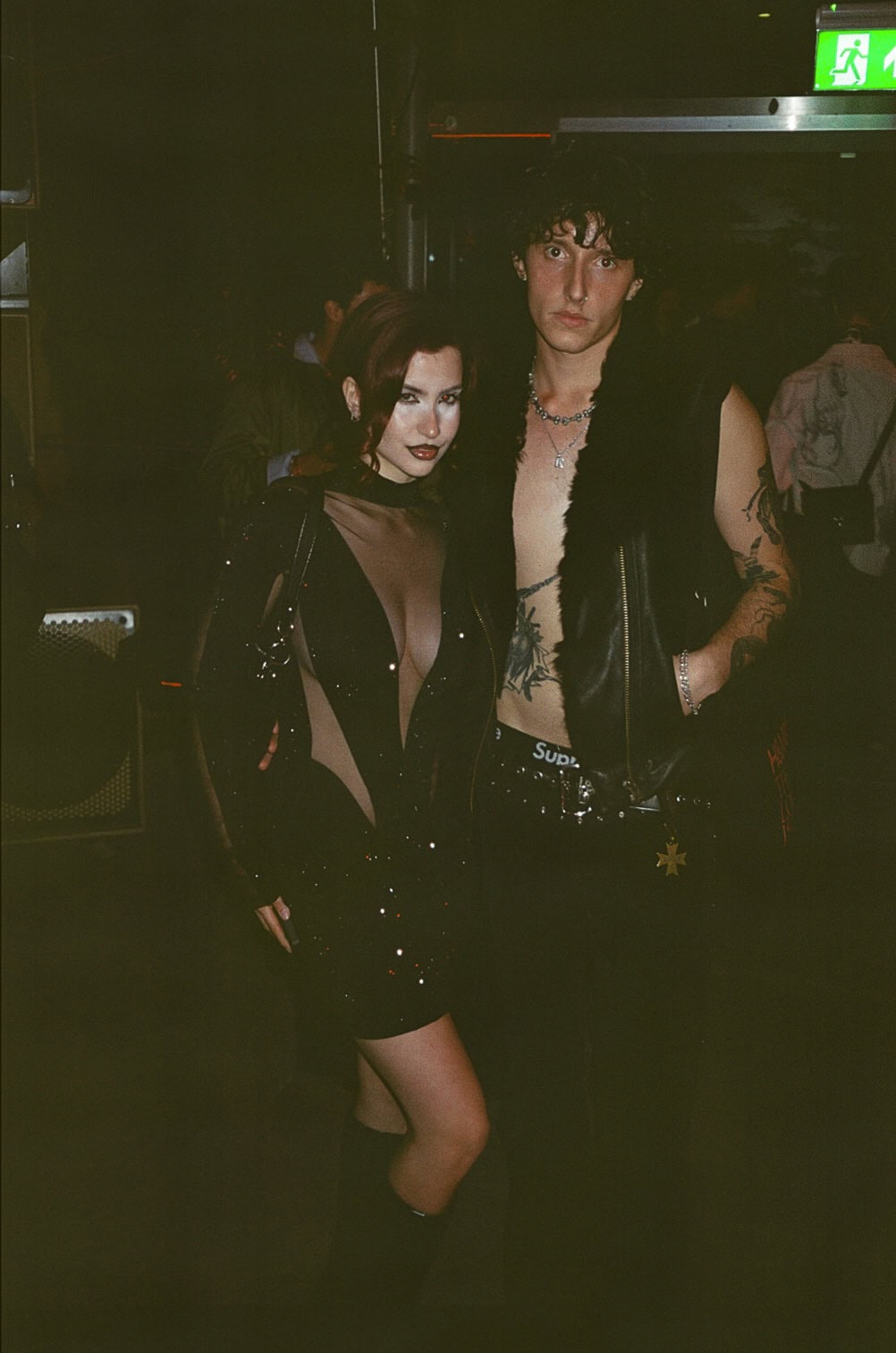 Guests in bold evening looks at H&M London Fashion Week runway event.