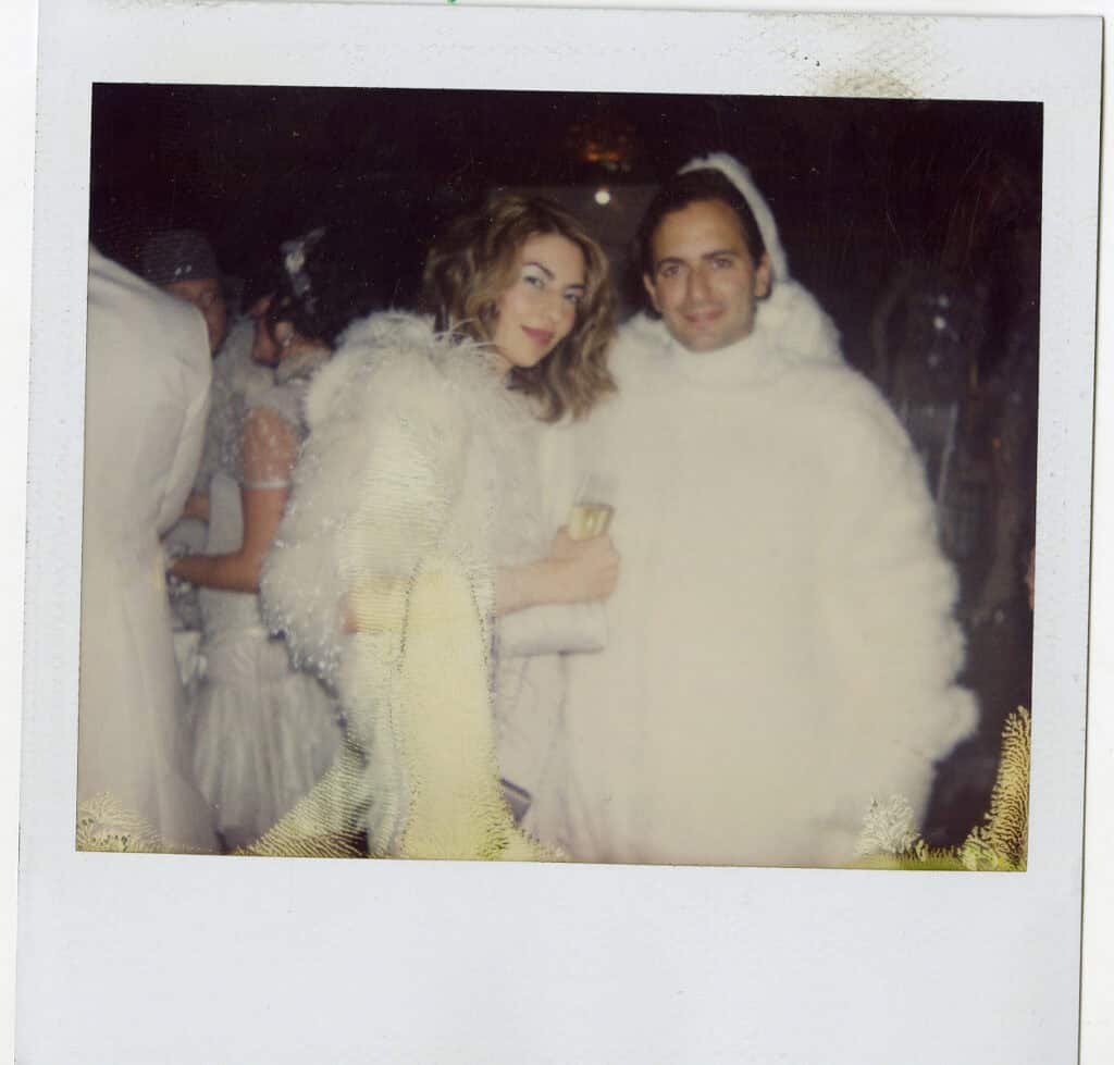 Polaroid photo of Sofia Coppola and Marc Jacobs in matching white outfits at a 2009 W Magazine event, photographed by Robert Rich.