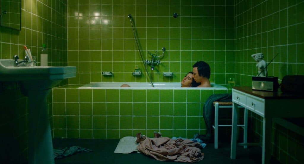 A bathtub scene from “Paul and Paulette Take a Bath,” featuring Paul and Paulette in a green-tiled bathroom.
