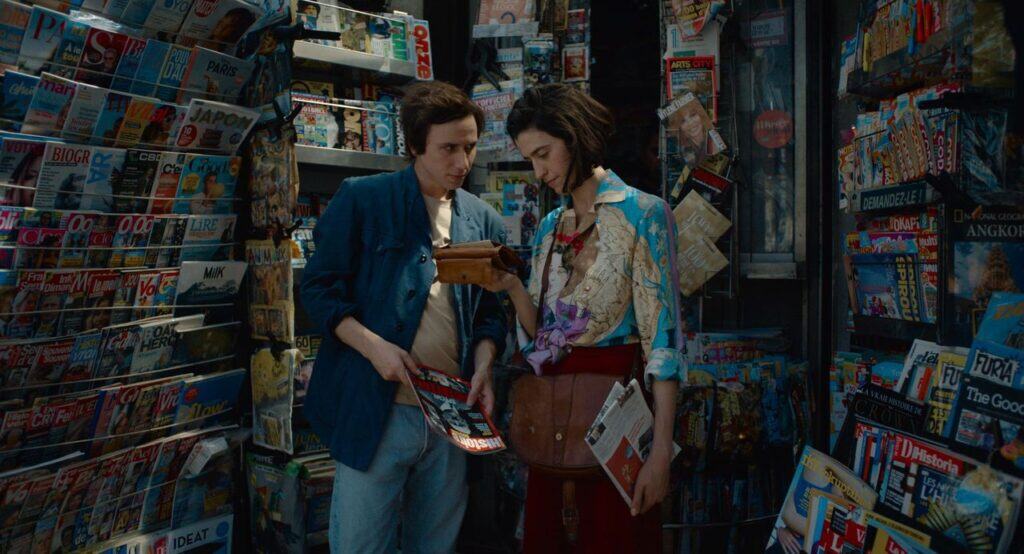 A newsstand scene from “Paul and Paulette Take a Bath,” with Paul and Paulette looking through magazines.