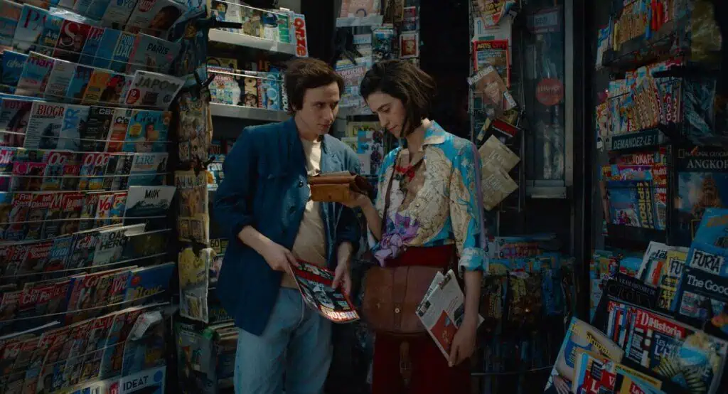 A newsstand scene from “Paul and Paulette Take a Bath,” with Paul and Paulette looking through magazines.
