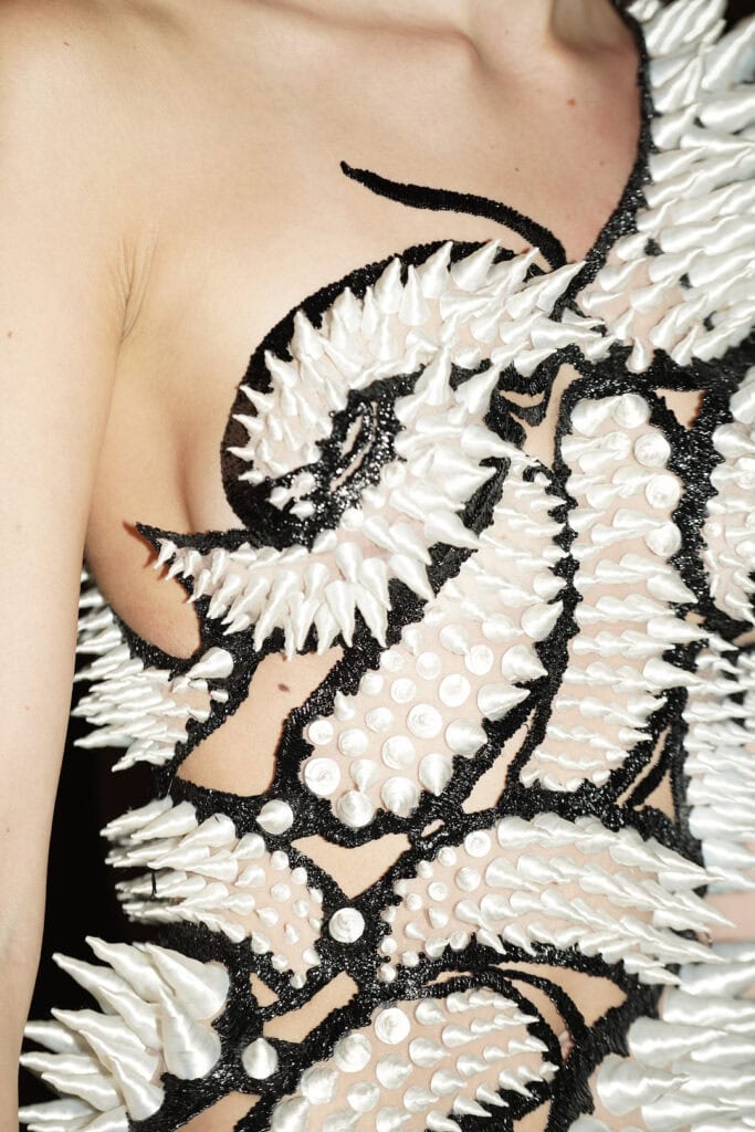 White organic relief bodice from Karina Bond SS26 inspired by coral and bone-like forms in high-texture fabrication.