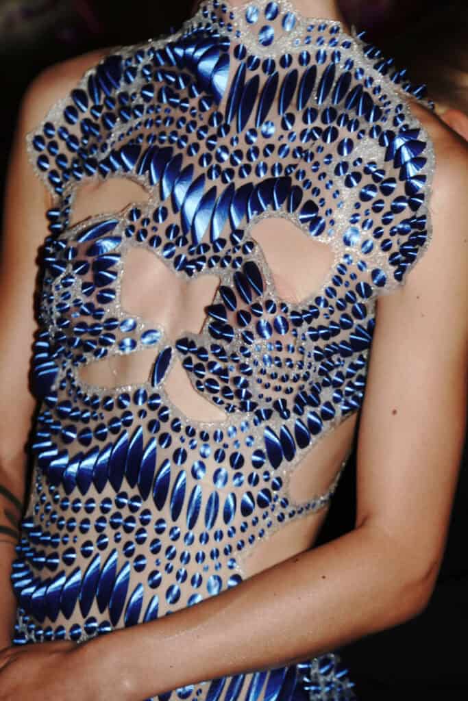 Blue bio-digital swirling textured bodice from Karina Bond SS26 evoke fractal growth and fluid pattern design.
