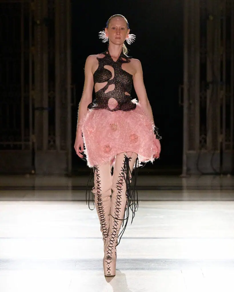 Pink petal-layer dress from Karina Bond SS26 collection with floral-inspired textile engineering.