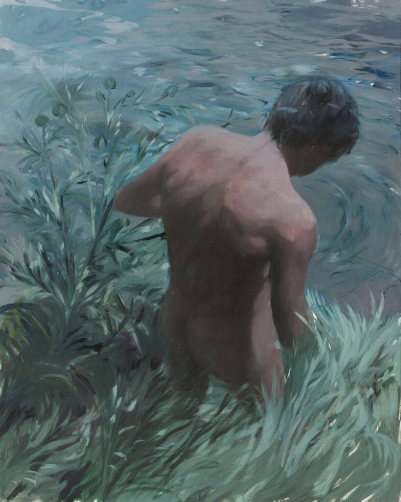 Painting by João Gabriel showing a nude figure from behind by the water, surrounded by soft green grass and blue reflections, evoking quiet queer intimacy.