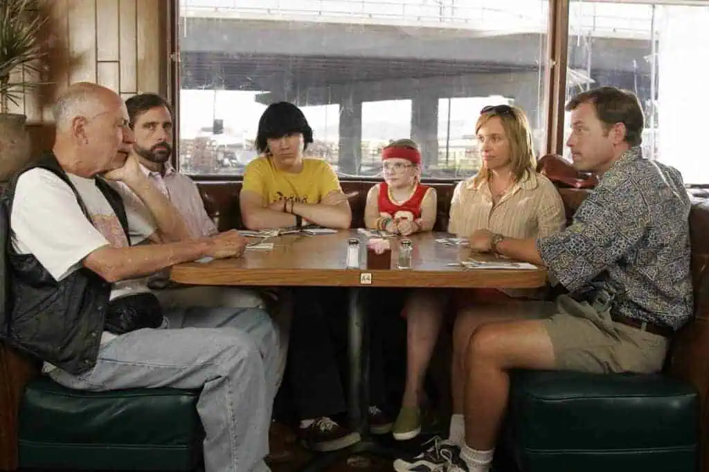Family sitting around a diner booth waiting for waffles à la mode in a scene from “Little Miss Sunshine” (2006).