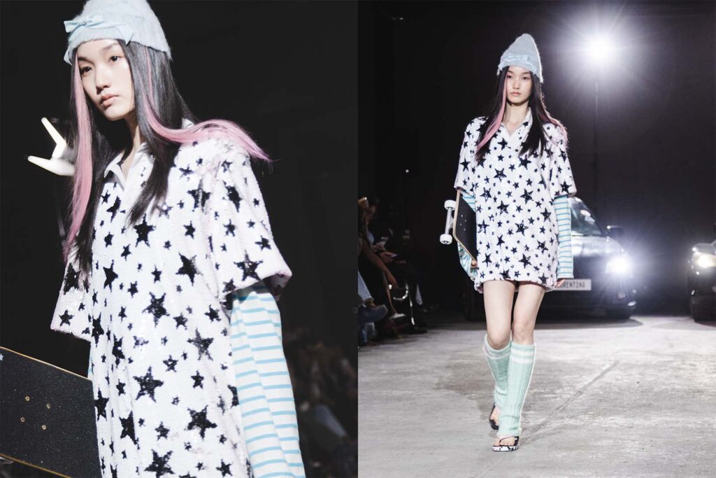 Model walking the runway in a star-patterned oversized shirt with striped sleeves and pastel accessories during Florentina Leitner SS26 show.