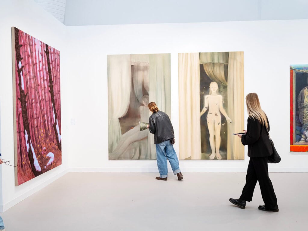 Installation view of Anna Ruth’s paintings Final Form (2024) and Final Form II (2025) at Grimm Gallery during Frieze London 2025, featuring ghostly figures, cascading curtains, and surreal, dreamlike imagery.