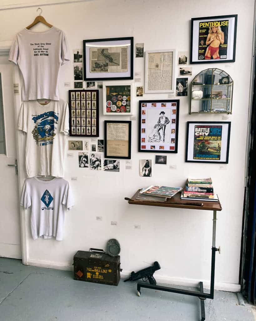 Wall of memorabilia, magazines, and T-shirts from Emma Sielaff’s collaborative “Finders Keepers” exhibition.
