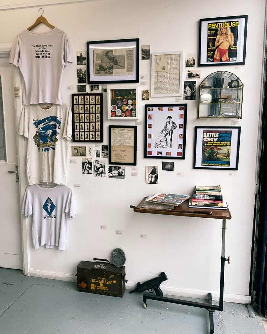 Wall of memorabilia, magazines, and T-shirts from Emma Sielaff’s collaborative “Finders Keepers” exhibition.