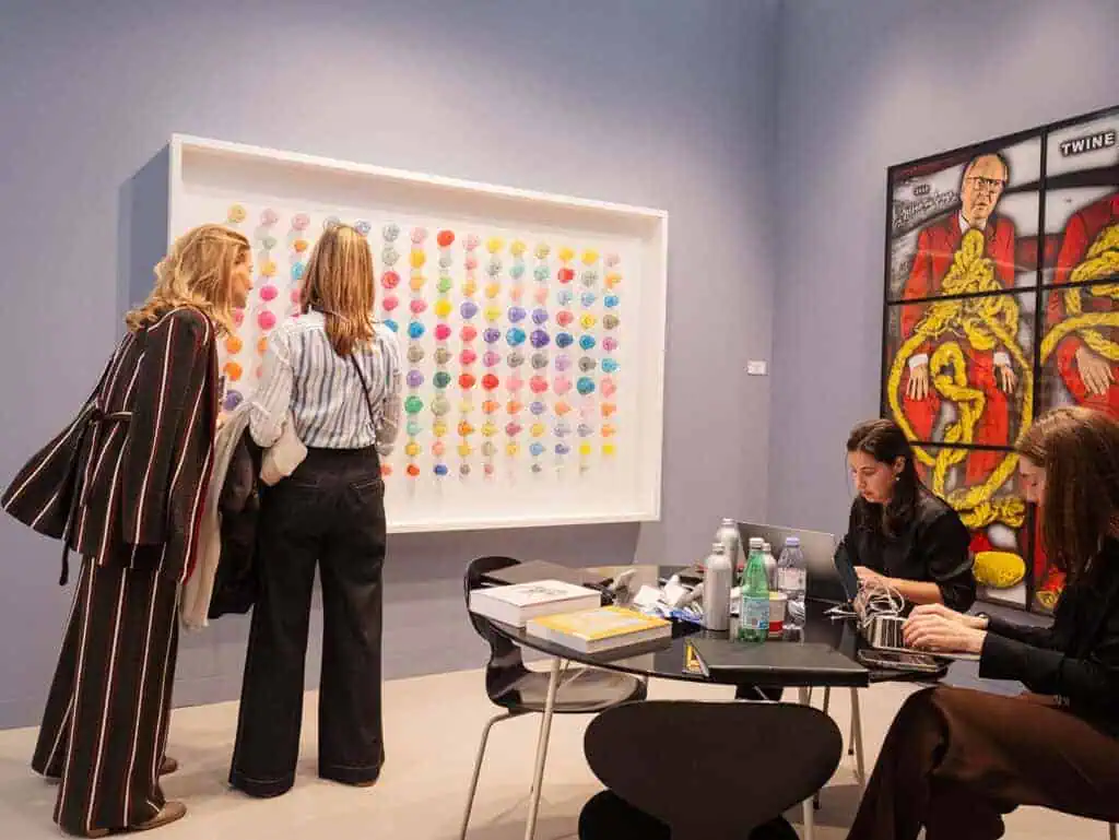Visitors view Do Ho Suh’s textile-based installation of colorful doorknobs at Lehmann Maupin Gallery during Frieze London 2025, exploring themes of space, memory, and impermanence.