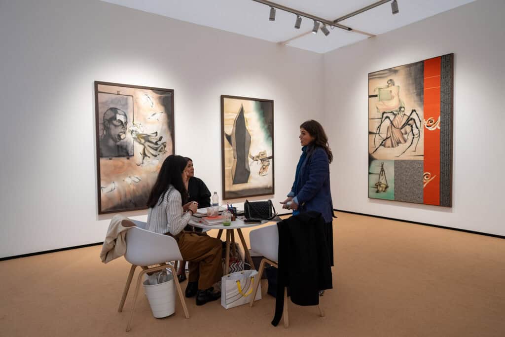 Visitors at Vadehra Art Gallery during Frieze Masters 2025 view Anju Dodiya’s mixed-media works from Ancestral Log, blending charcoal, pastel, and fabric to explore the spiritual and everyday.