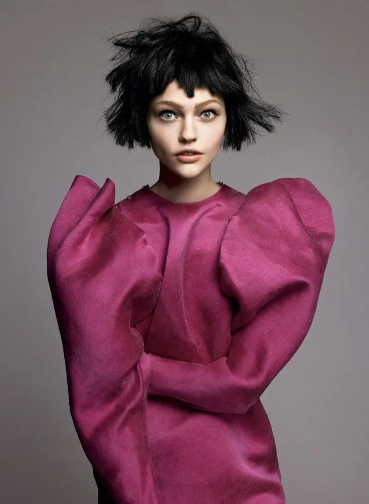 Lanvin editorial look featuring a sculptural pink dress inspired by Alber Elbaz’s signature silhouettes.