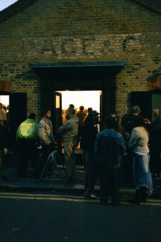 Guests gathering outside Gander’s AW25 presentation at 228 Brick Lane, London, before entering the exhibition space.