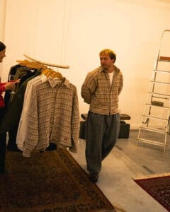 Gander founder Calum Gregory inside the AW25 presentation space, surrounded by pieces from the new collection.