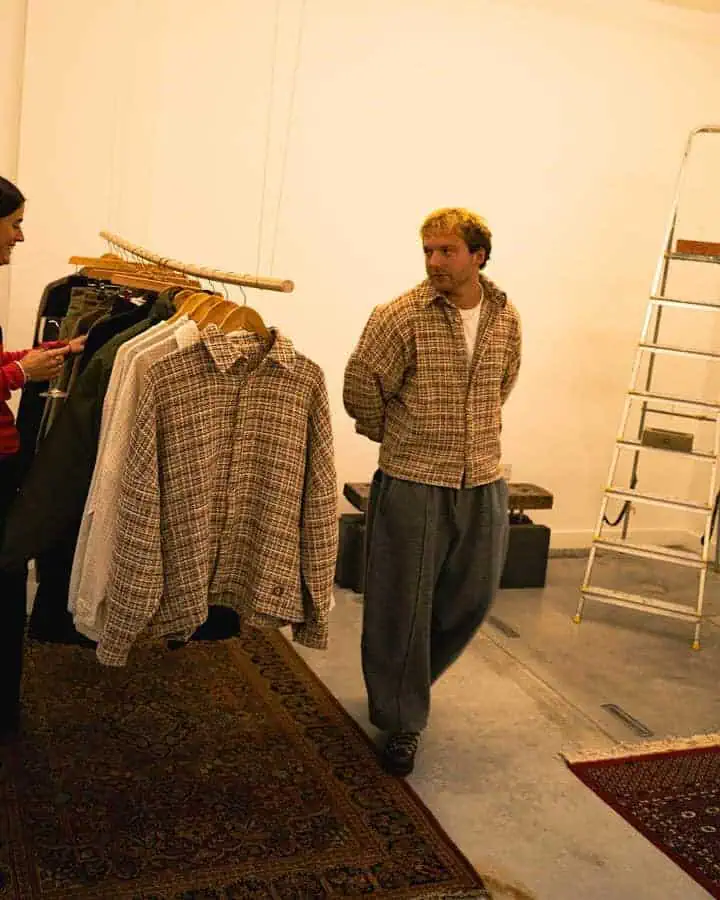 Gander founder Calum Gregory inside the AW25 presentation space, surrounded by pieces from the new collection.
