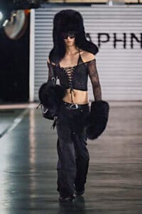 Model in black lace-up crop top and oversized furry accessories from Daphne.lab × Marrknull’s “In a Hurry” collection.