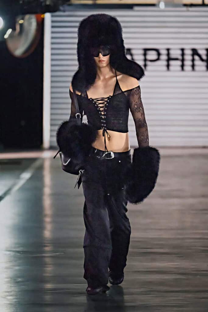 Model in black lace-up crop top and oversized furry accessories from Daphne.lab × Marrknull’s “In a Hurry” collection.