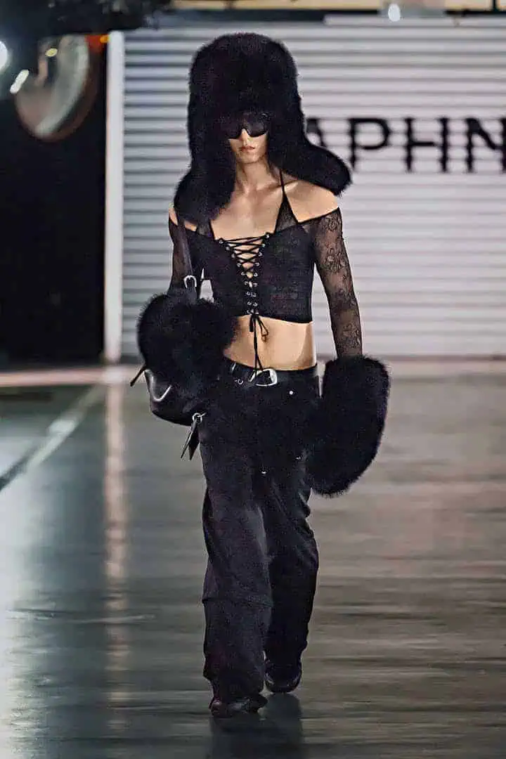 Model in black lace-up crop top and oversized furry accessories from Daphne.lab × Marrknull’s “In a Hurry” collection.