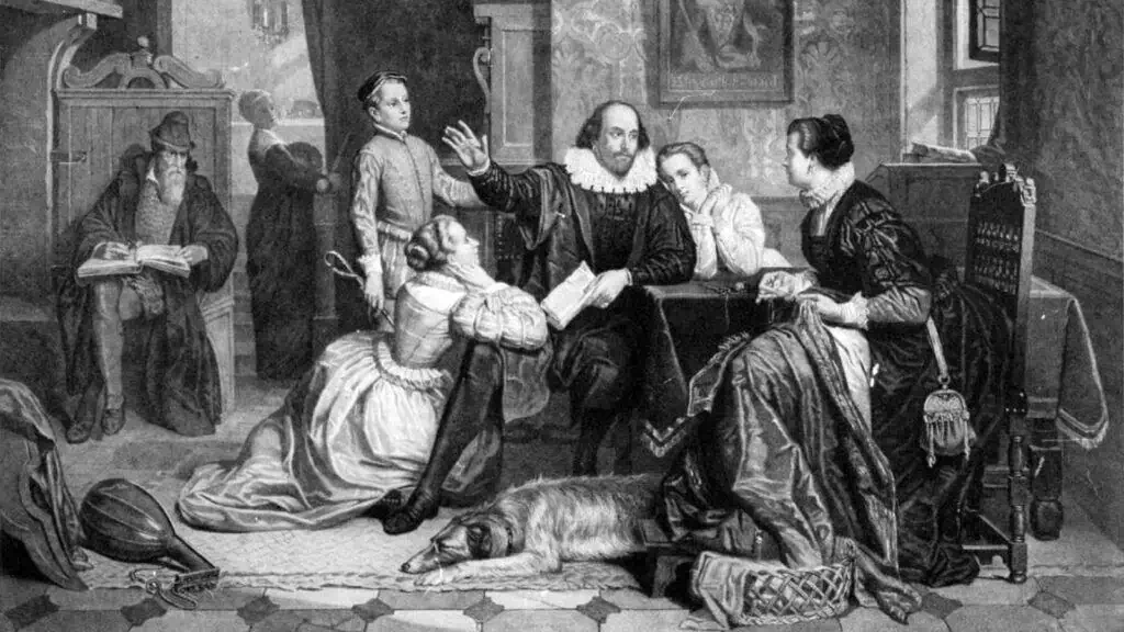 A black-and-white illustration shows a bearded man reading at left, while a group of people in historical clothing gather around a table. A dog lies on the floor, and Hamnet's mother kneels at the center, listening attentively.