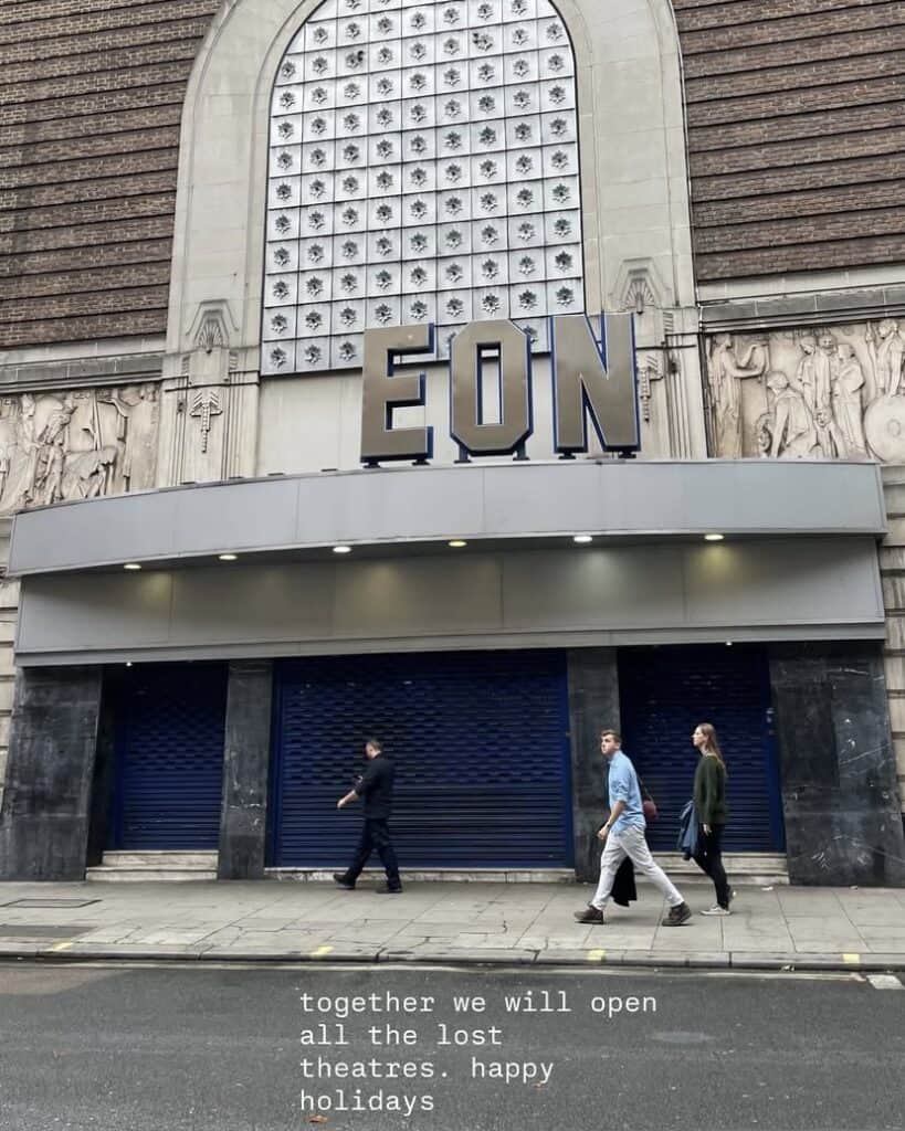 Three people walk past the closed entrance of a historic theatre building with EON displayed above. The text overlay reads: together we will open all the lost theatres and every Lost Nightclub. Happy holidays.