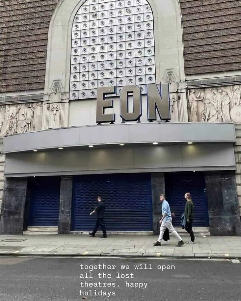 Three people walk past the closed entrance of a historic theatre building with EON displayed above. The text overlay reads: together we will open all the lost theatres and every Lost Nightclub. Happy holidays.