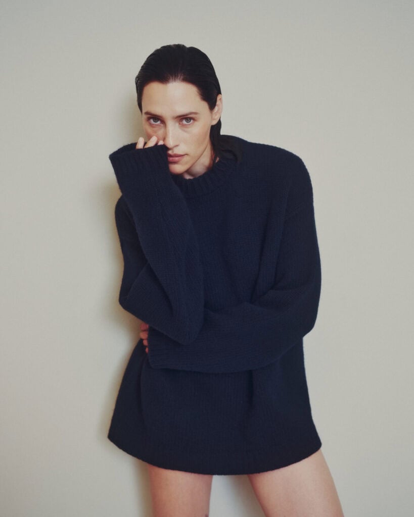 A woman in a black sweater.