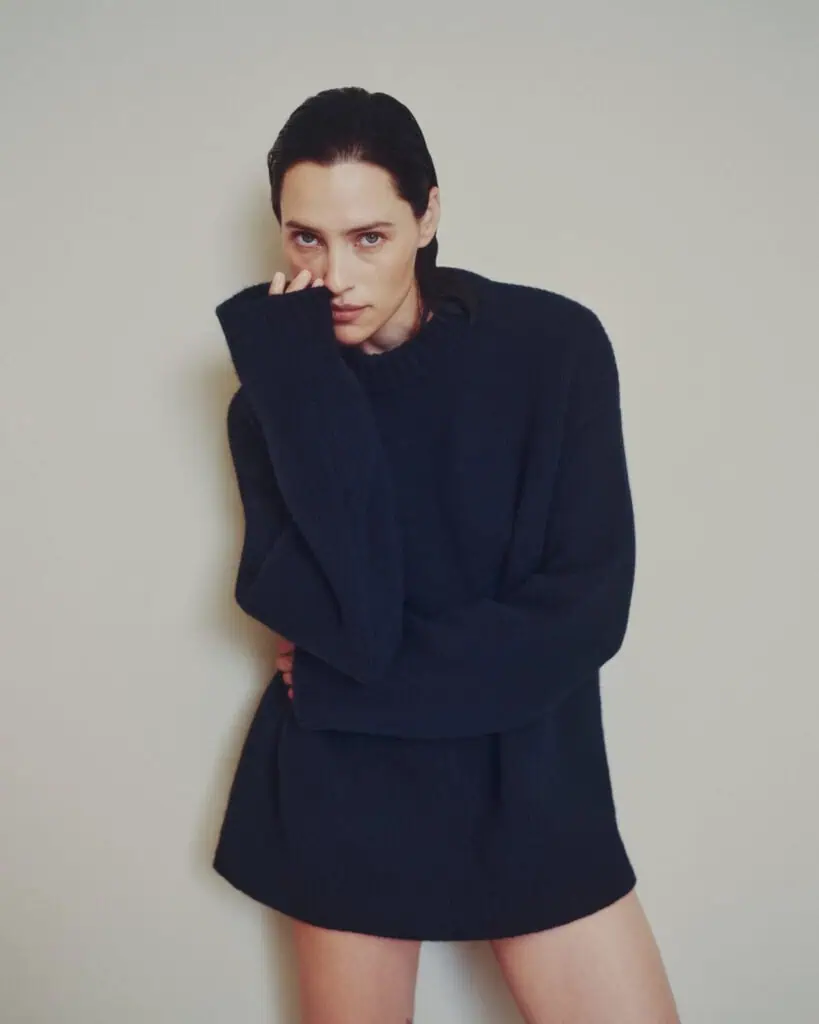 A woman in a black sweater.