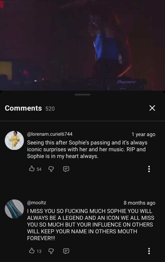Screenshot of YouTube comments under a dimly lit music performance video. Comments express grief over musician Sophie’s passing, highlighting her lasting influence and legacy in the music world.