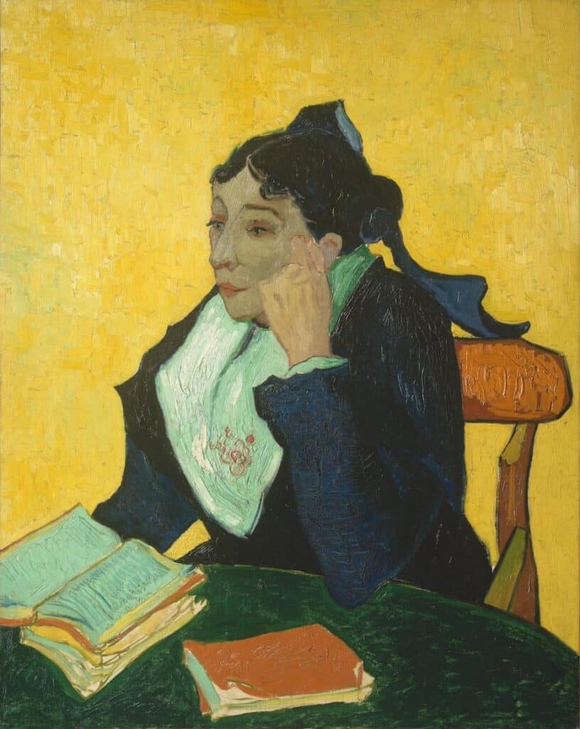 A woman with dark hair and a blue bow sits at a table, leaning her cheek on her hand, looking thoughtful. She wears a dark dress with a white collar, and there are open books on the table. The background is bright yellow.